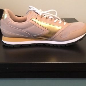 Brooks blush and gold sneaker.